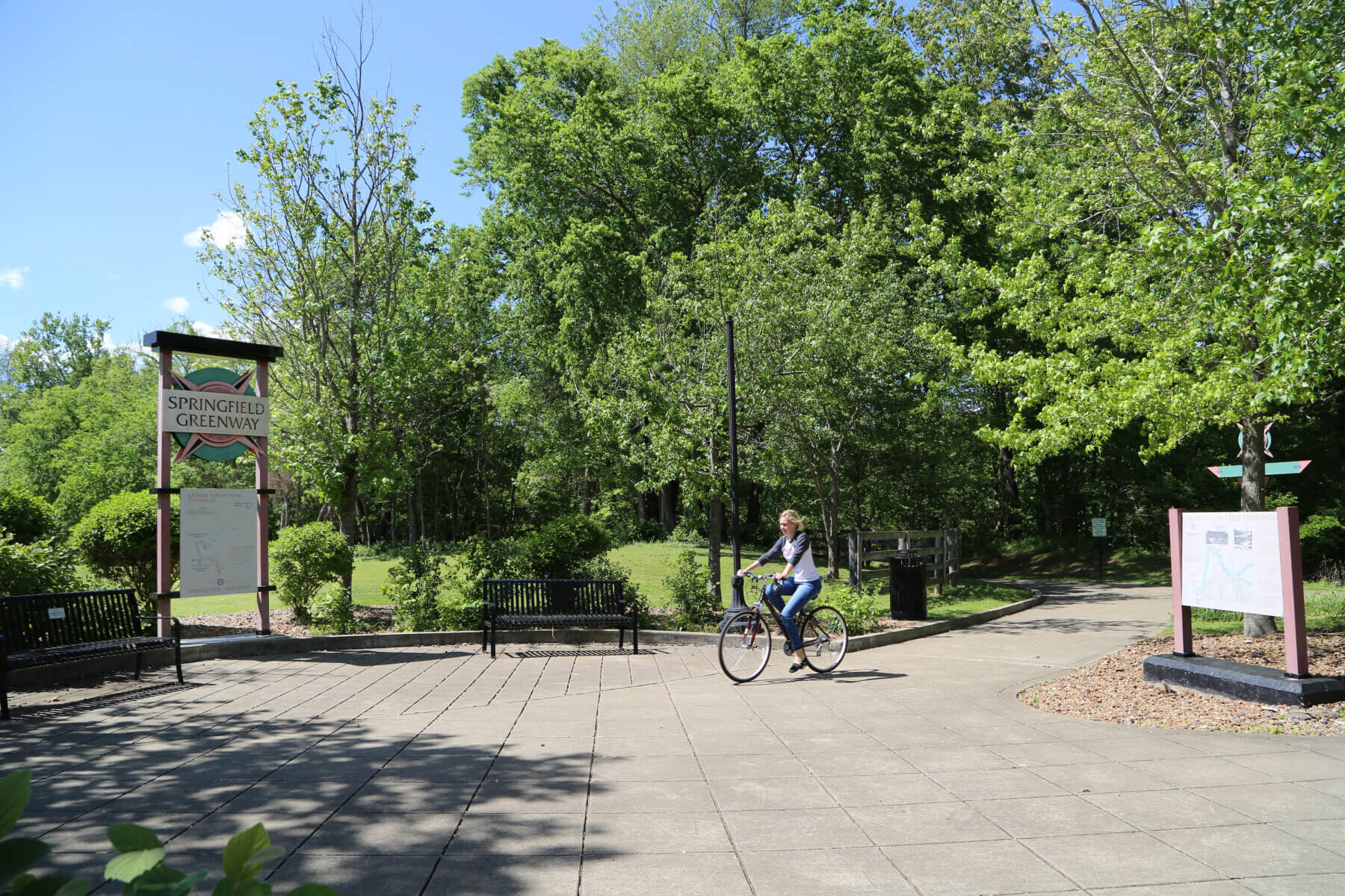 A woman riding a bike at the Springfield Greenway