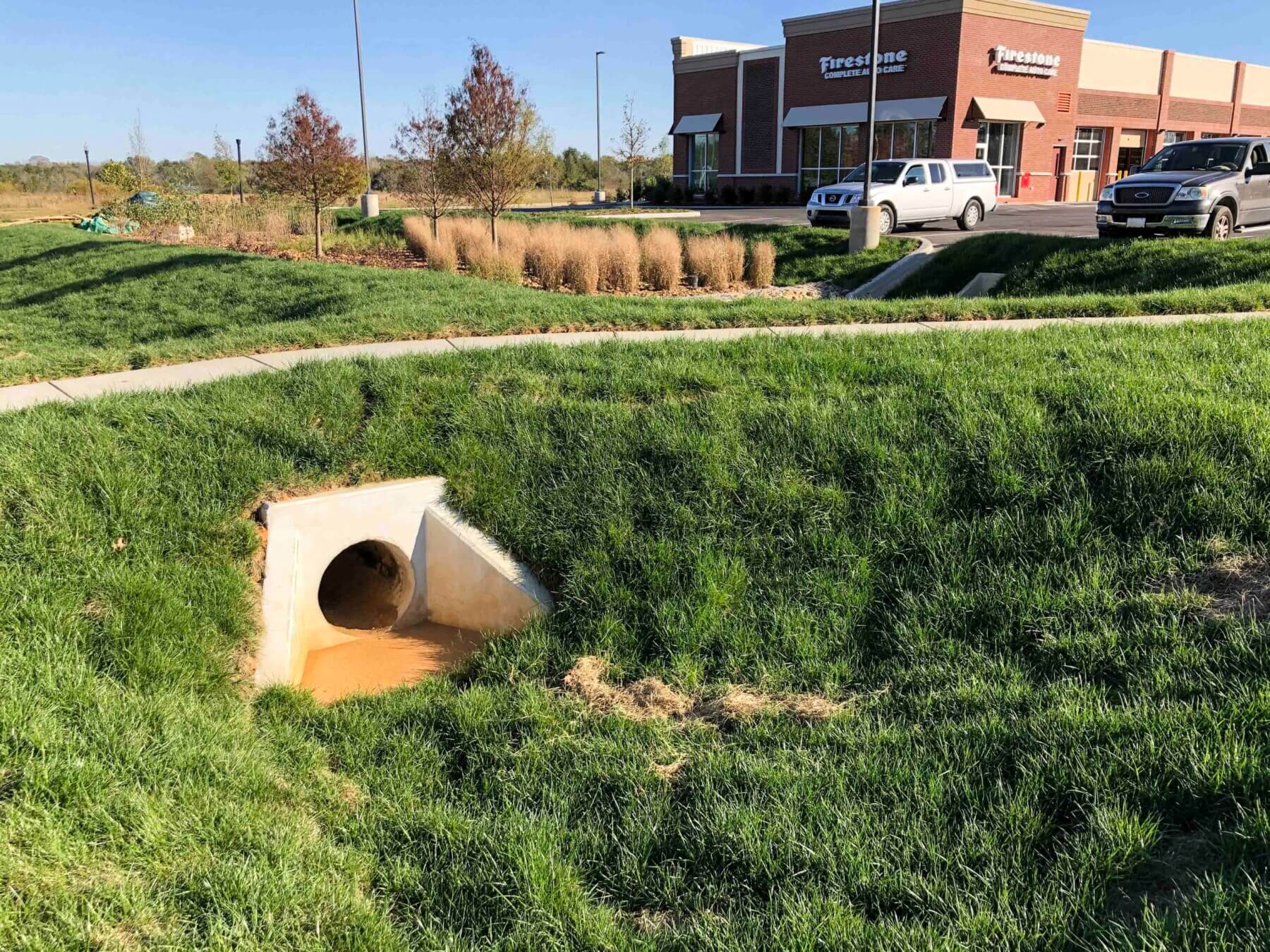 Stormwater infrastructure in front of a Firestone store