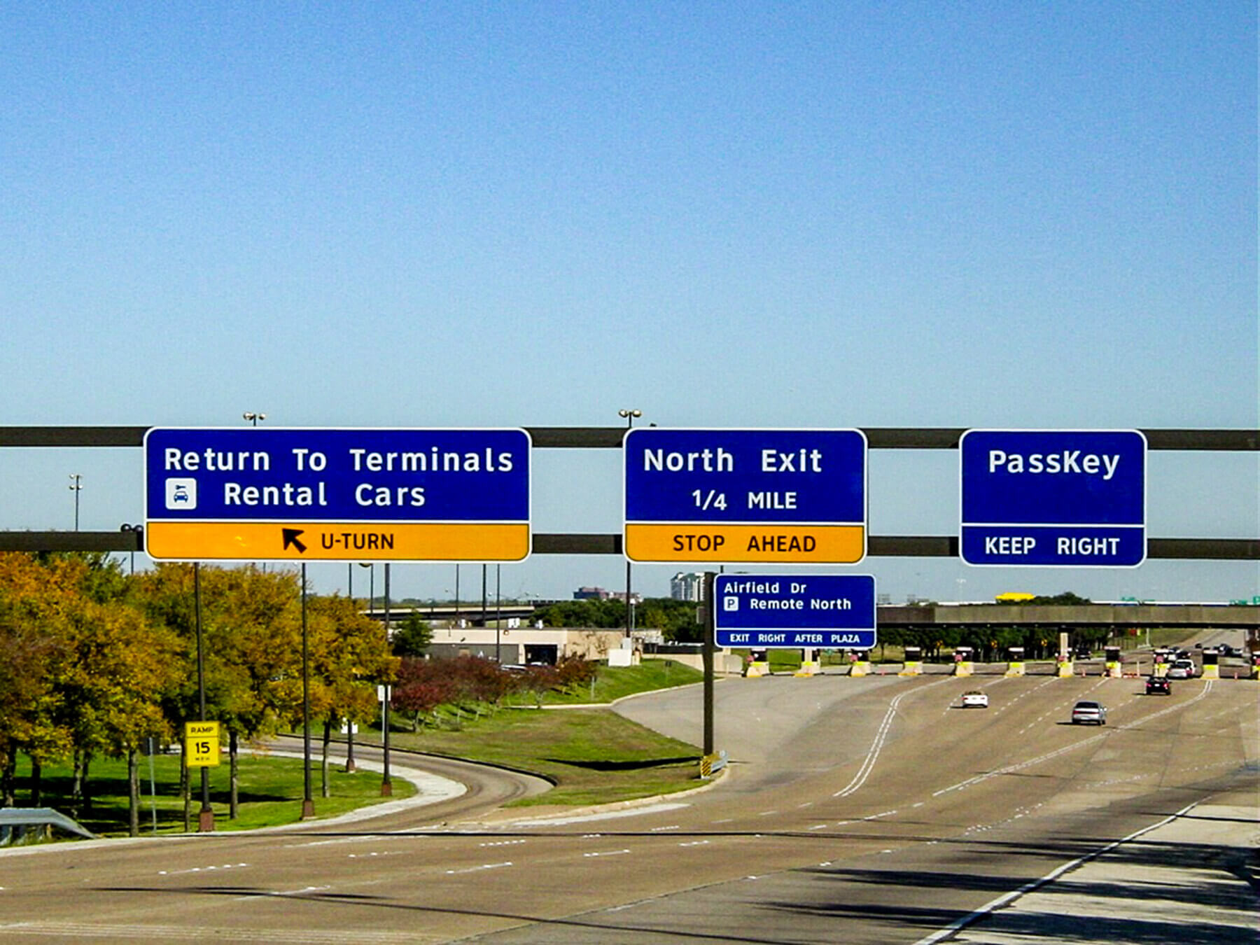 overhead signage on the roadway at Dallas/Forth Worth International Airport
