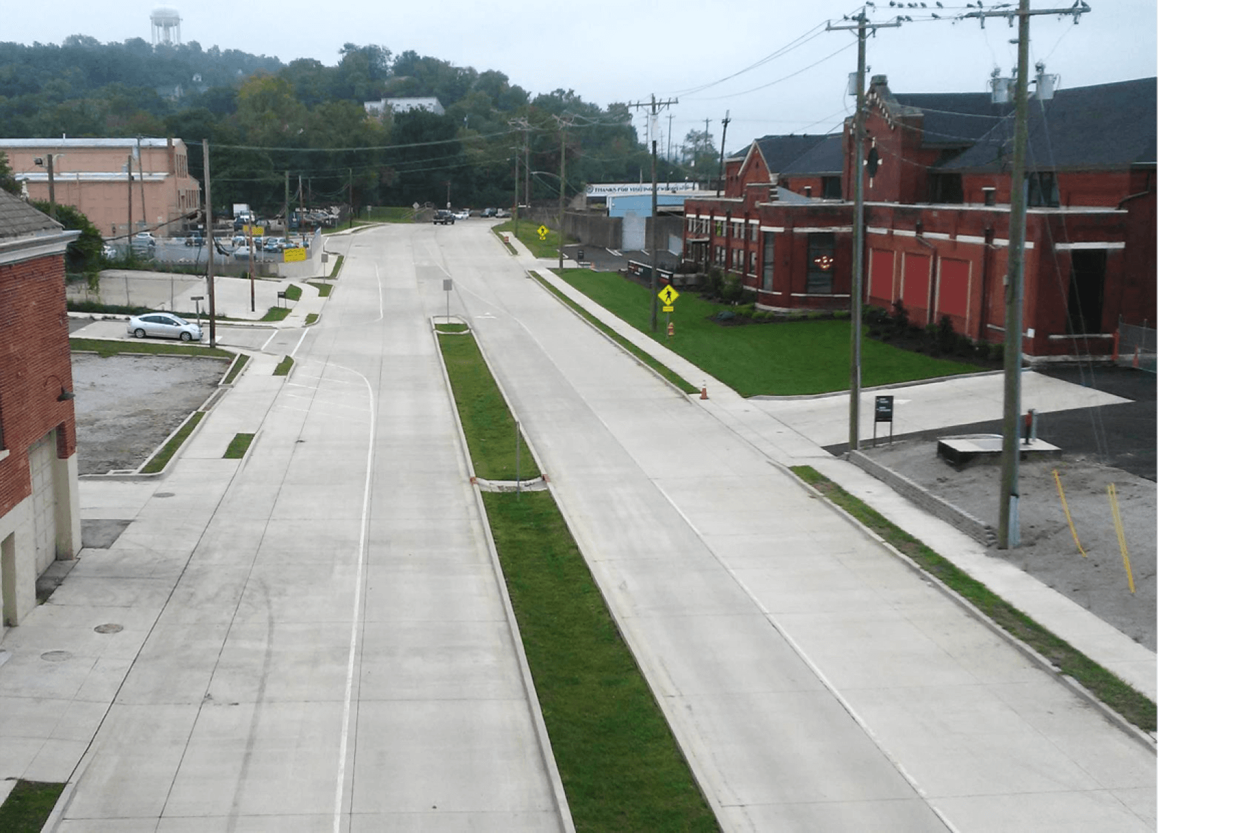 A multi-lane corridor with grass in the middle