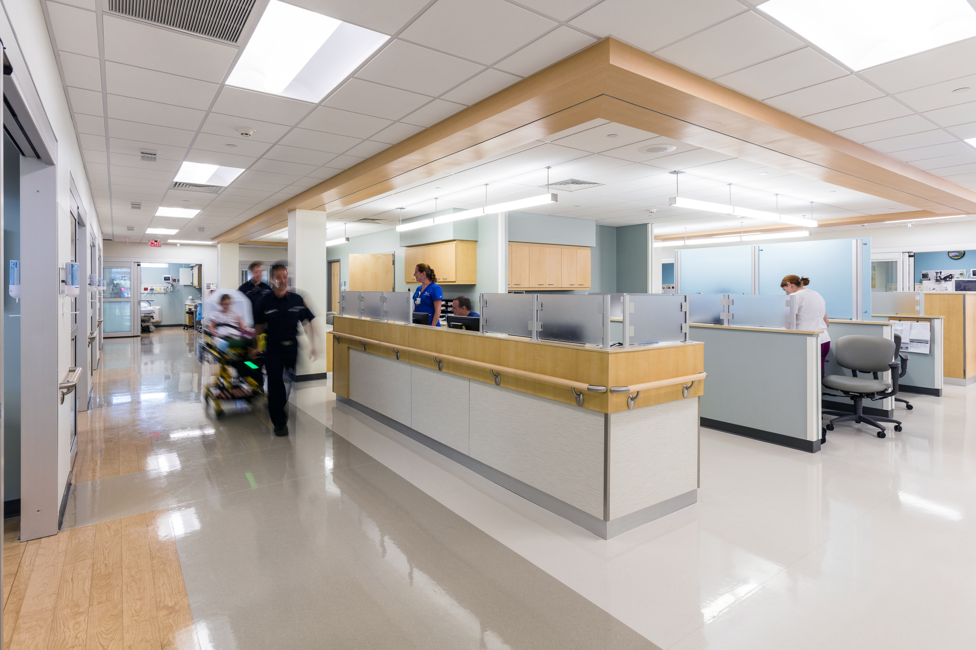 nurses and paramedics working in an emergency department