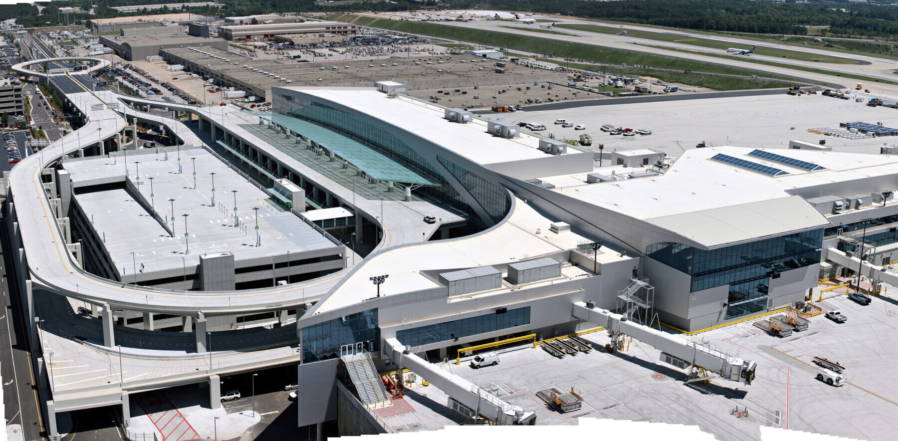 an aerial view of the international terminal at Hartsfield-Jackson Atlanta International Airport and surrounding area