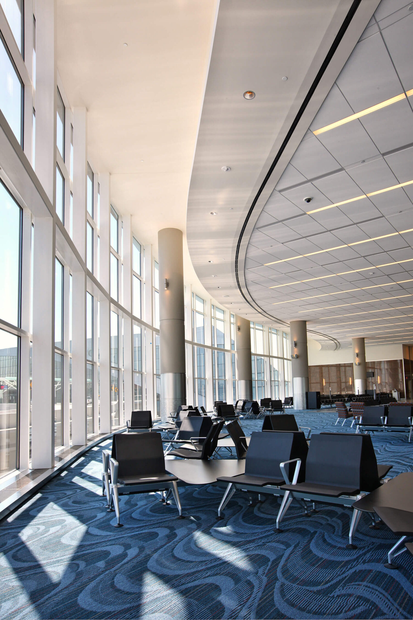 a seating area near the windows in the concourse at the international terminal at Hartsfield-Jackson Atlanta International Airport