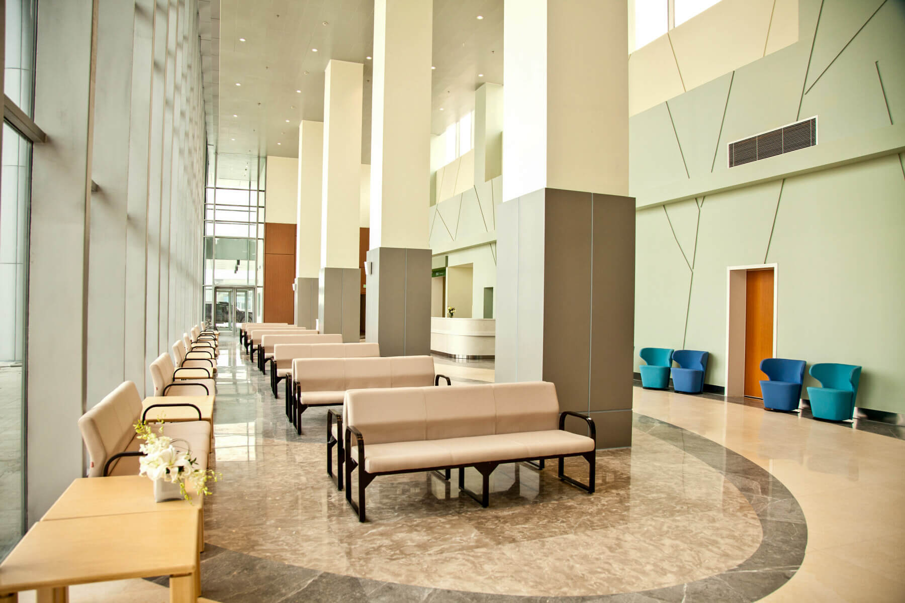 two-story lobby with benches and chairs for waiting