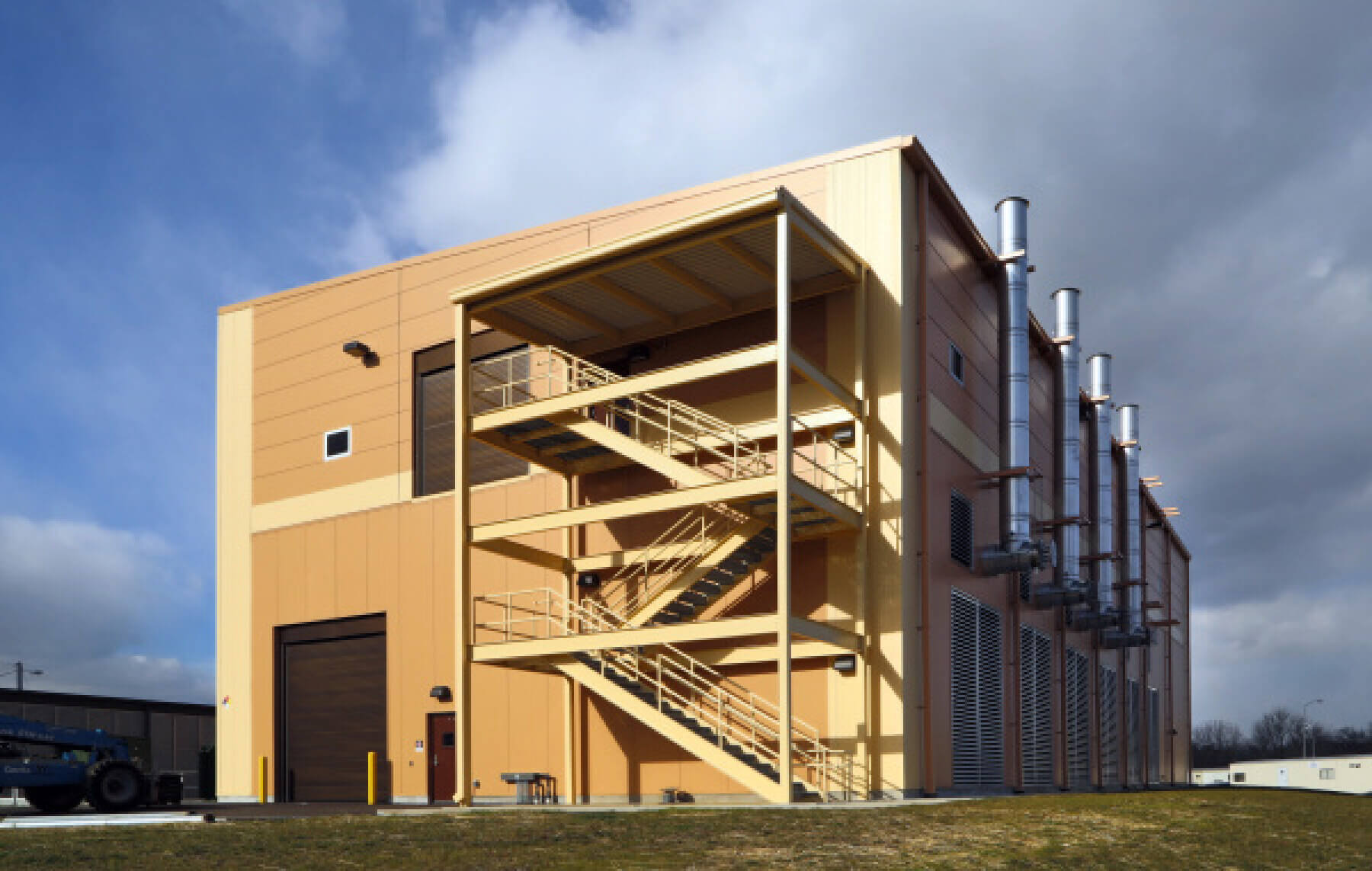 Side view of new electrical building featuring the exterior stair at K.R. Harrington Water Treatment Plant