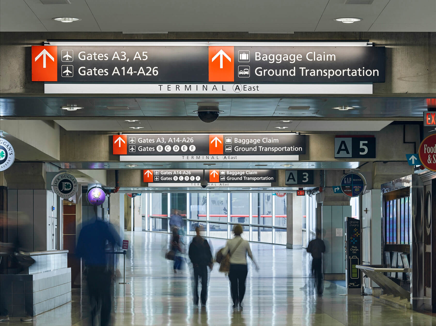 overhead wayfinding signage in the concourse of Terminal A at Philadelphia International Airport