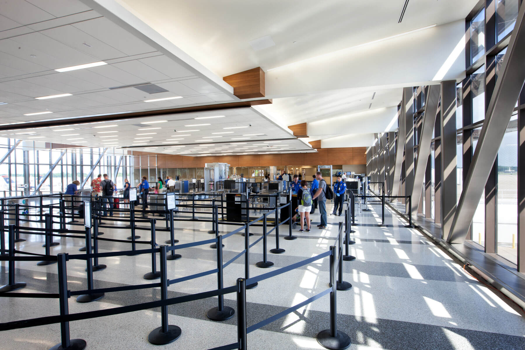 passengers standing in line at security screening at Norfolk International Airport