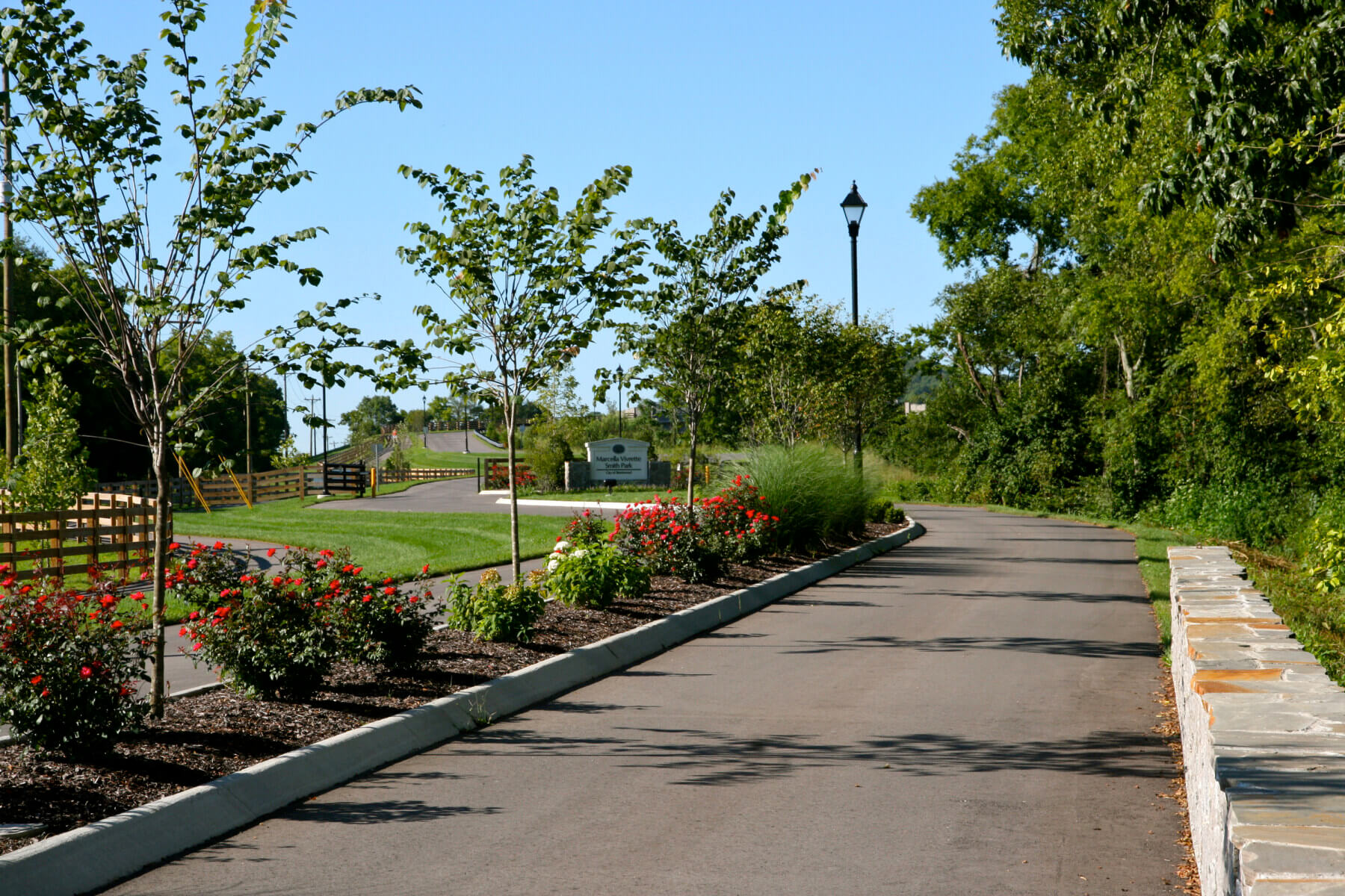A road and trees leading into Marcella Vivrette Smith Park