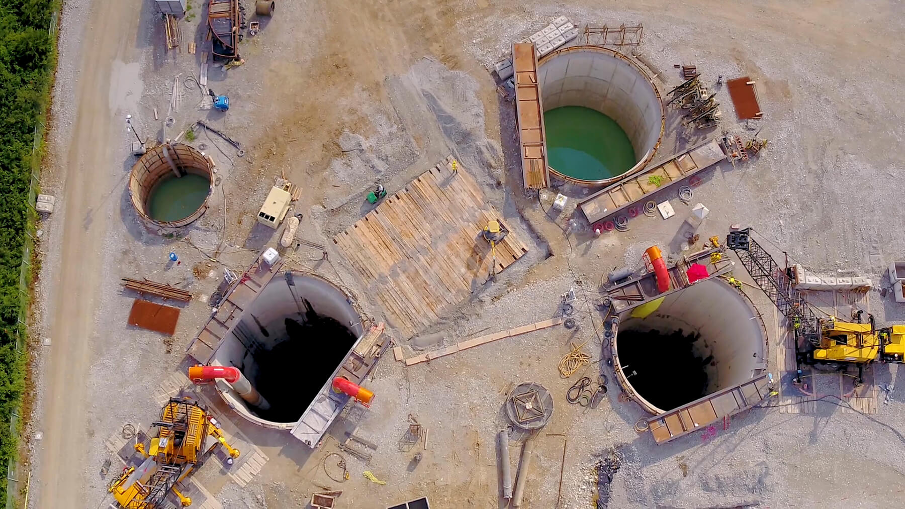 Three shafts of Deer Creek Sanitary Tunnel Pump Station under construction.