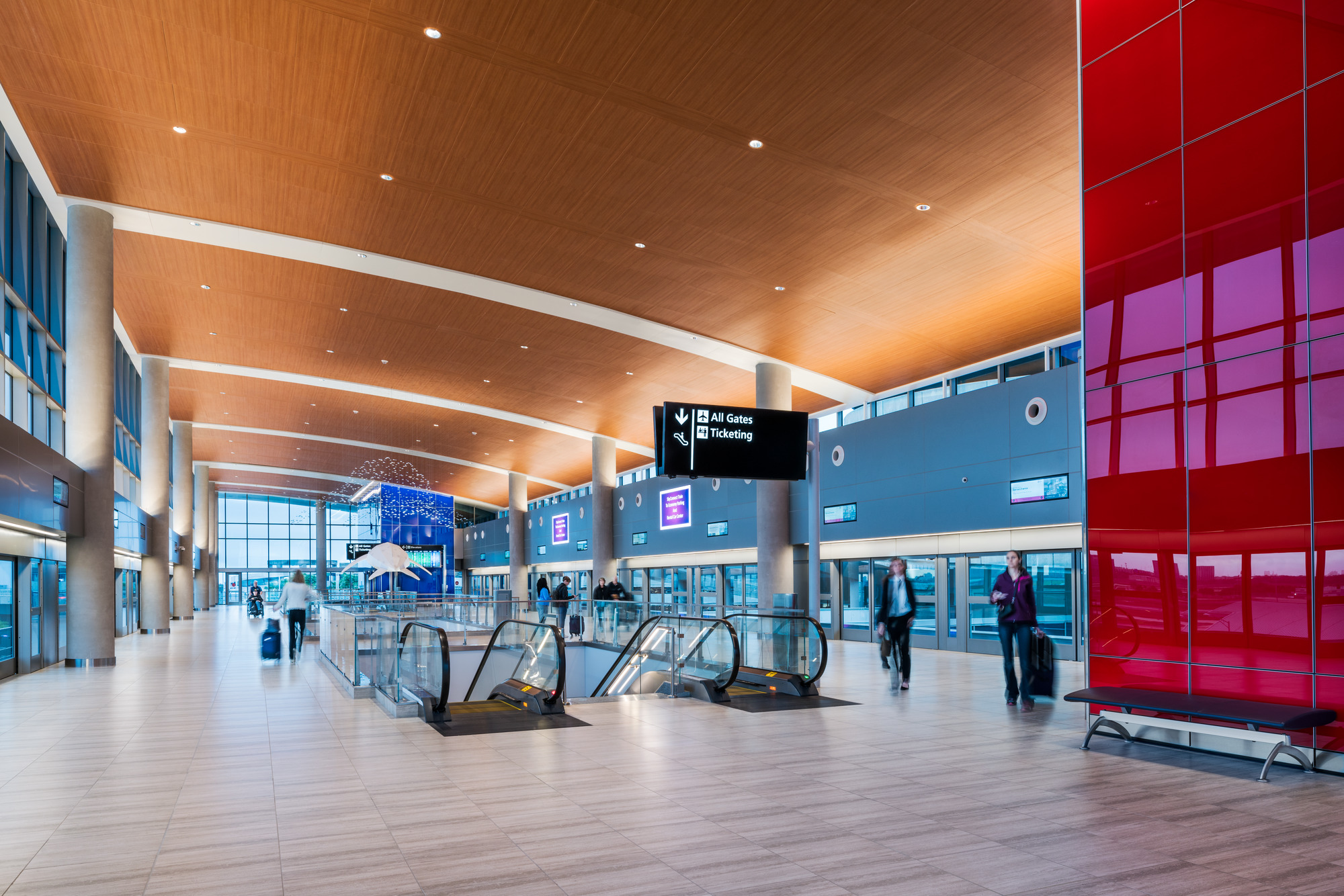 Travelers walking through the consolidated rental car center at tampa international airport