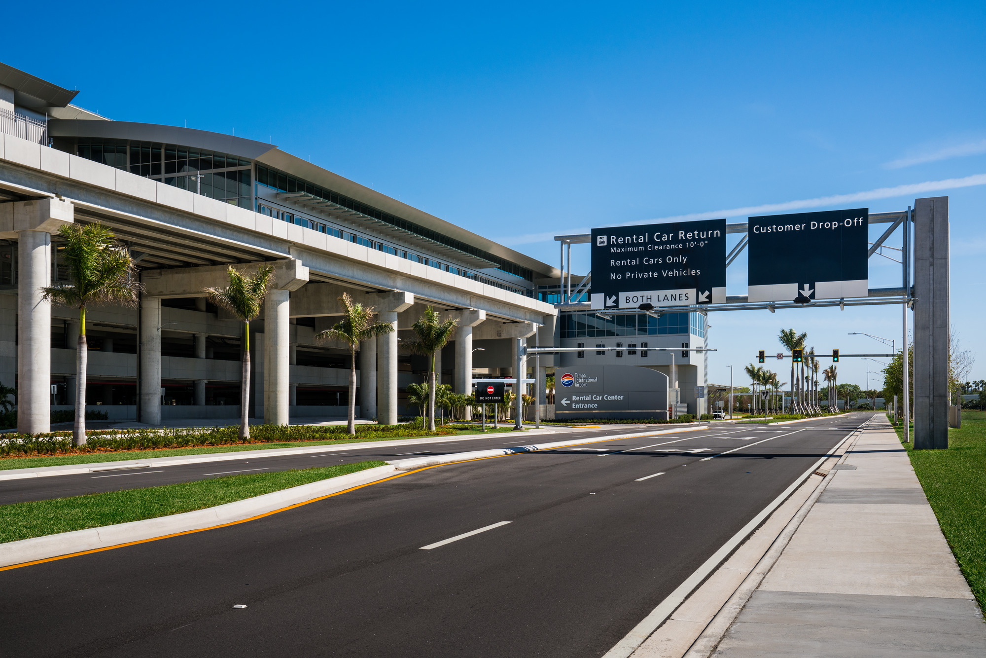 overhead raodway signs directing vehicles at tampa international airport