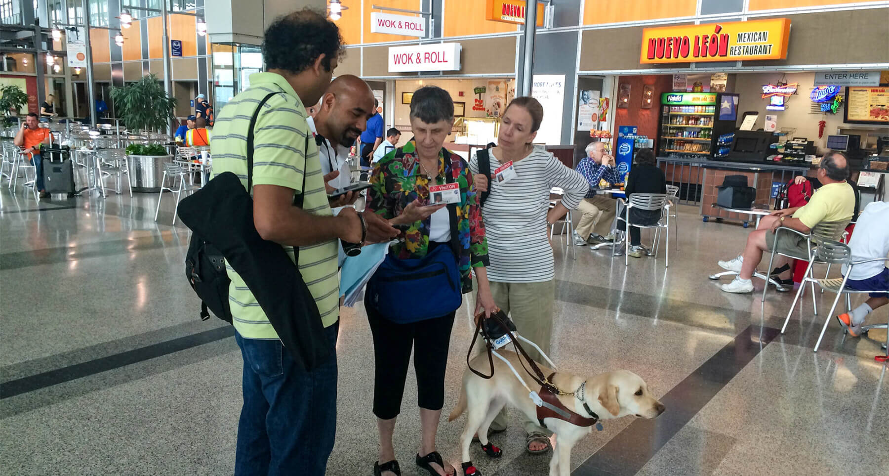 aging travelers and persons with disabilities using an app on their phones to navigate airport