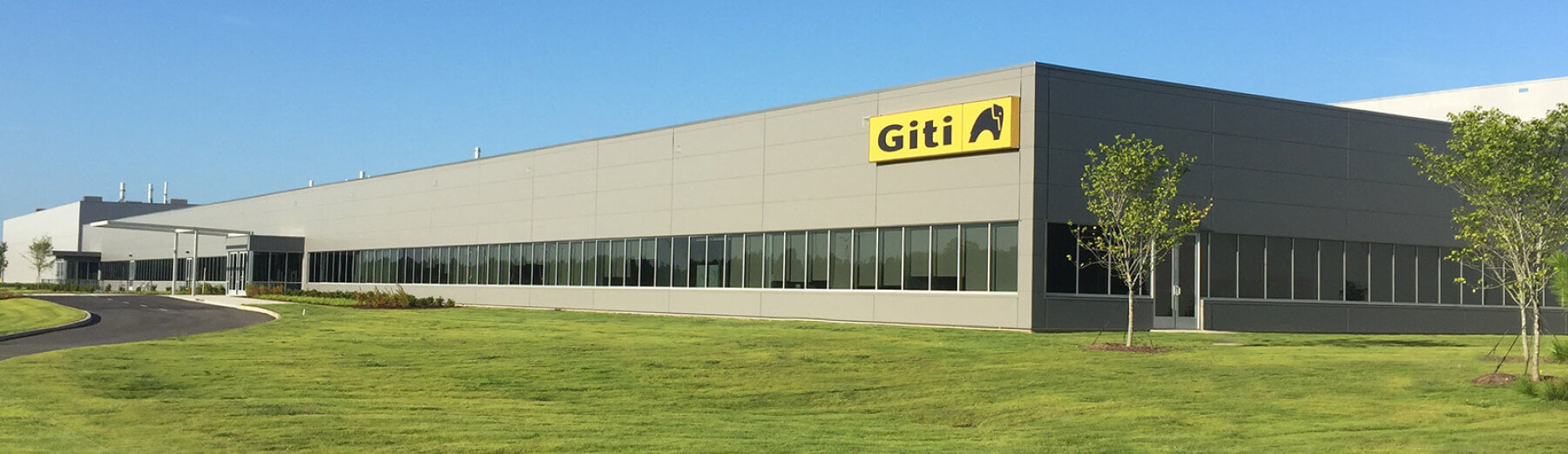 ground level view of completed plant, with Giti logo signage