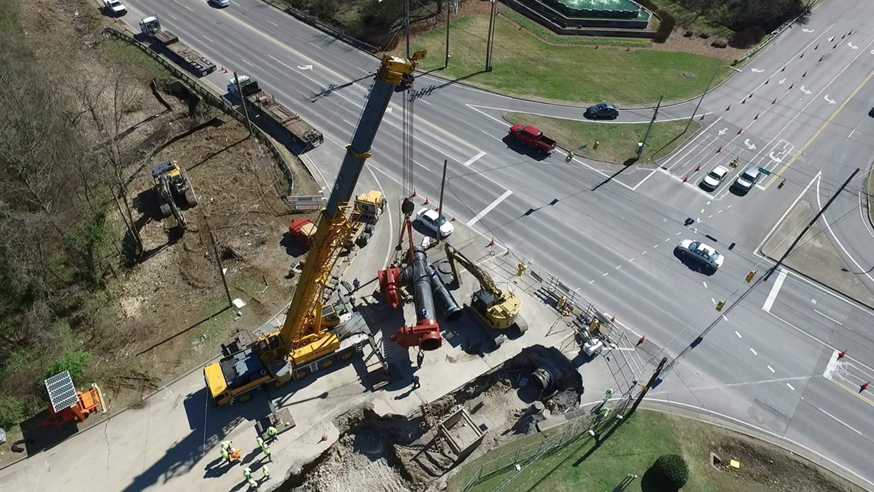Aerial view of pipe connection next to roadway