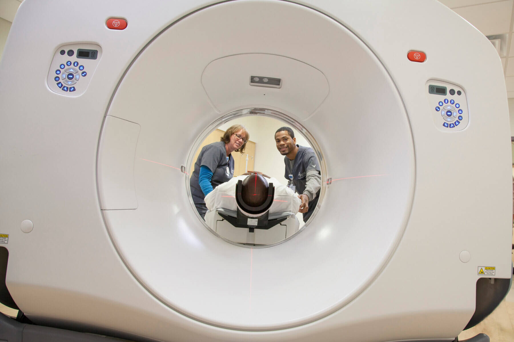 nurses conducting an MRI on a person