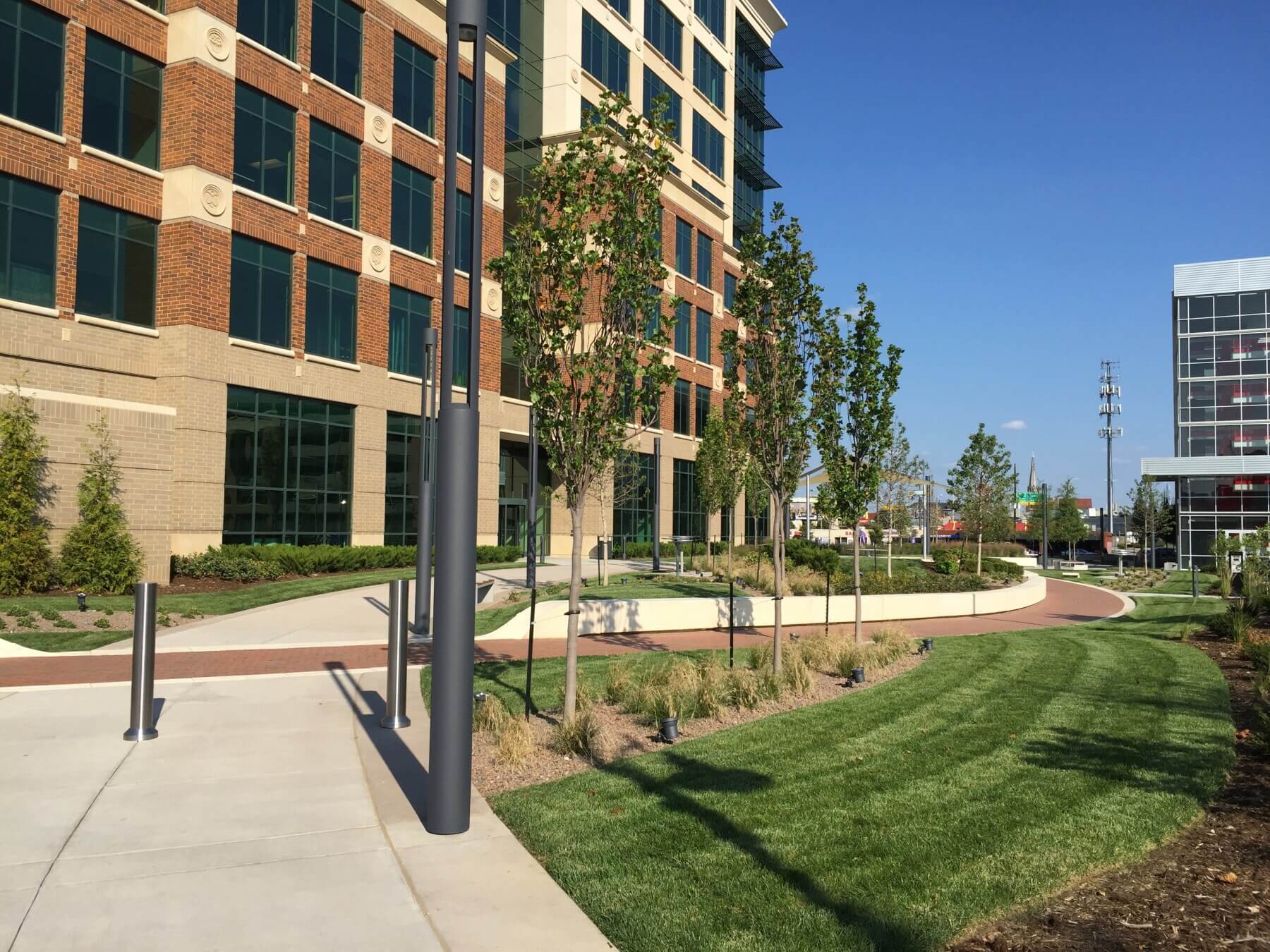 a shot of grass and metal poles outside of the University of Louisville’s J.D. Nichols Campus Plaza