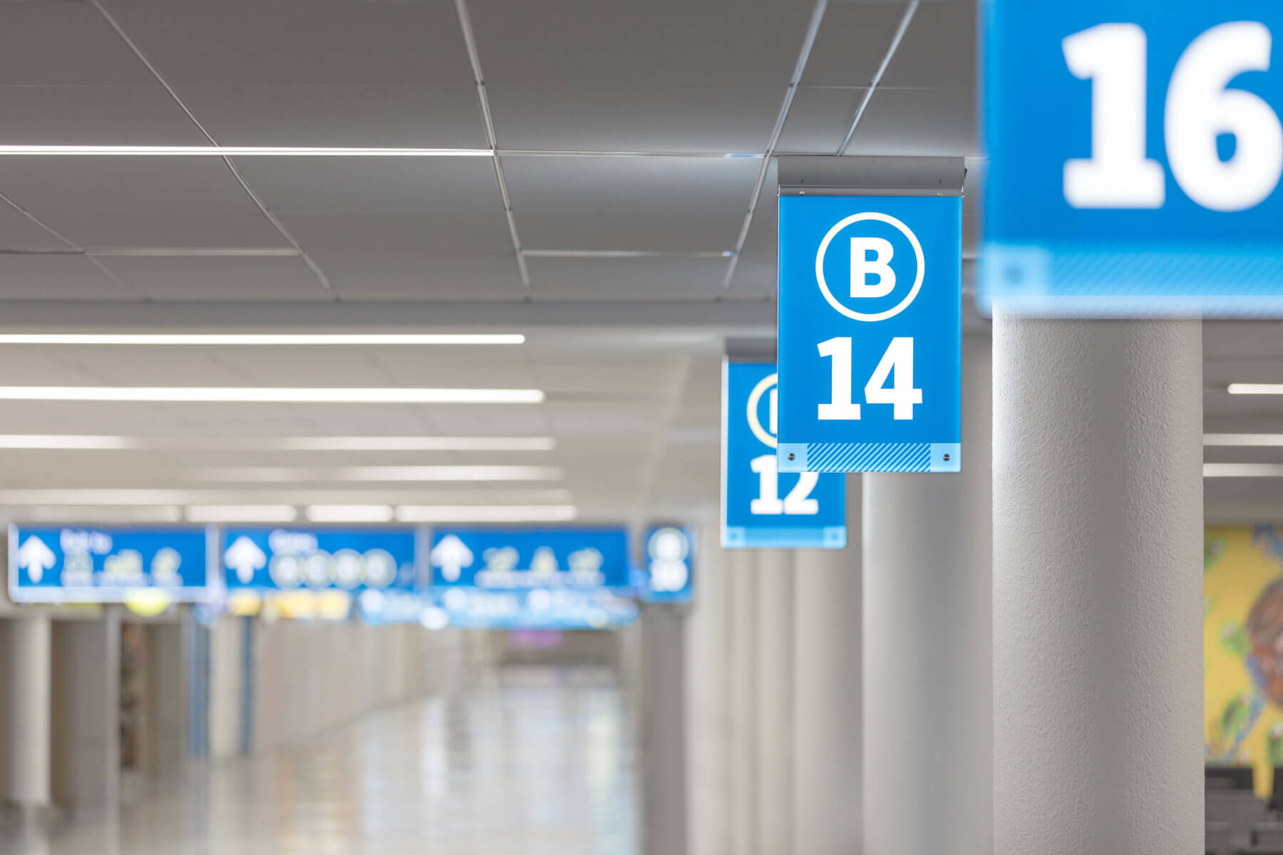 a close up view of the numerical signs at each gate in Charlotte Douglas International Airport