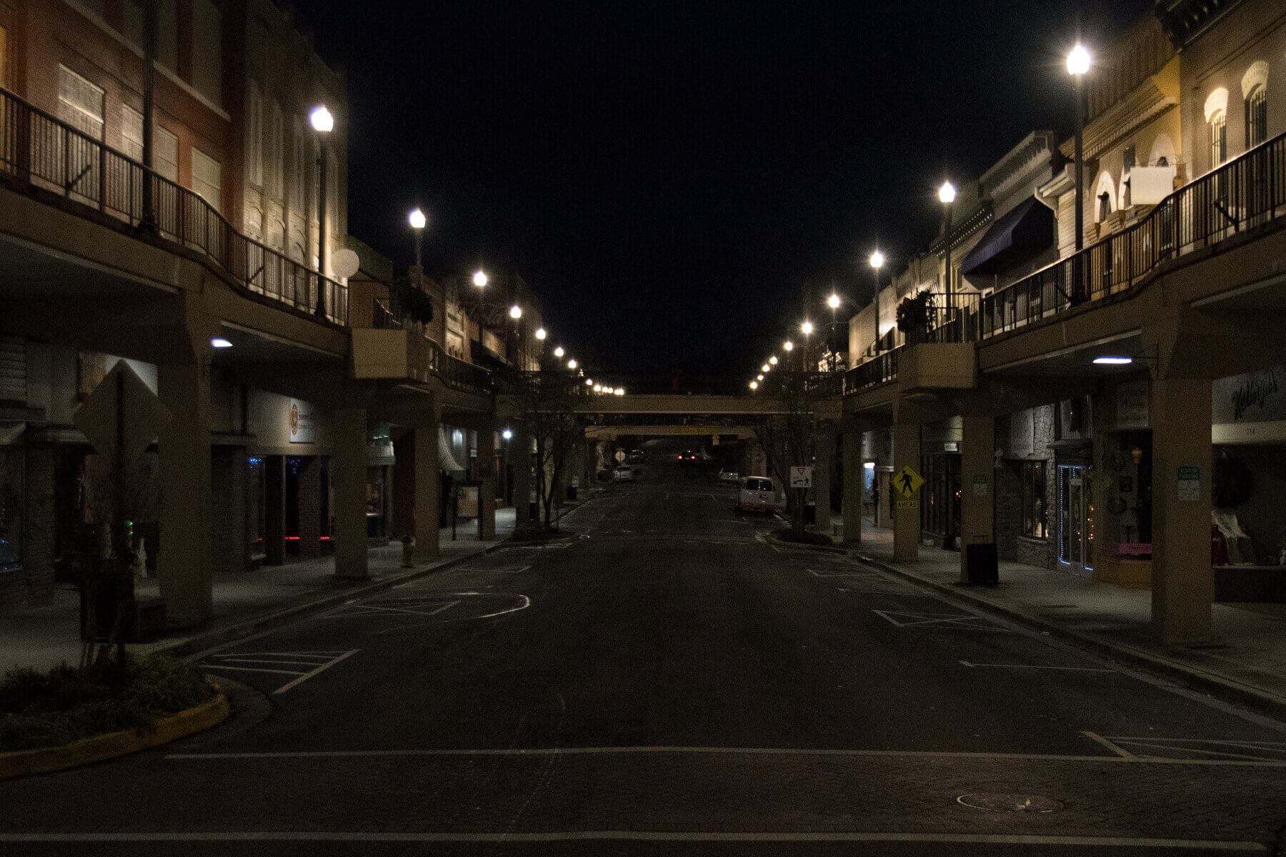 a night shot of a downtown street in Morristown with street lights on