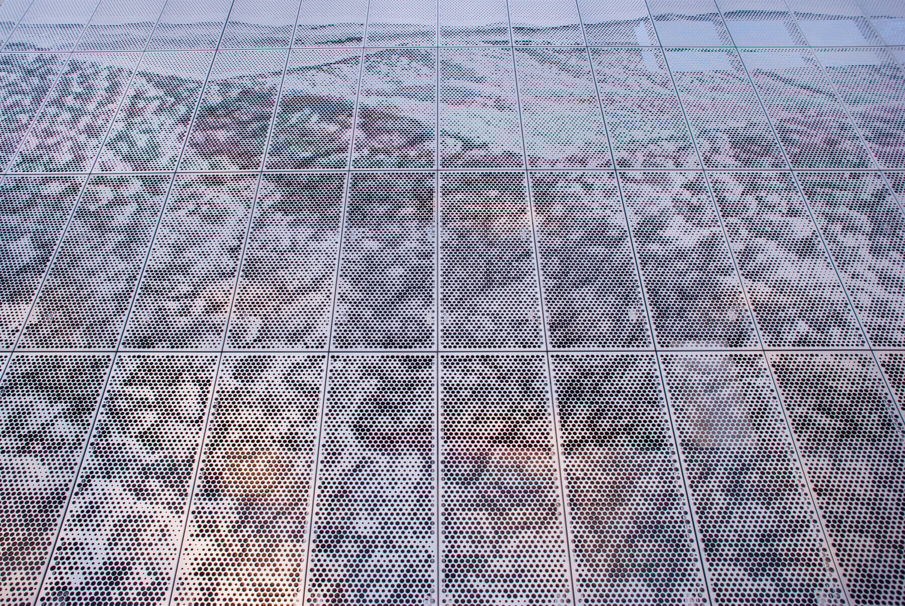 a close up of the perforated metal panel attached to the side of Asheville Regional Airport’s parking garage