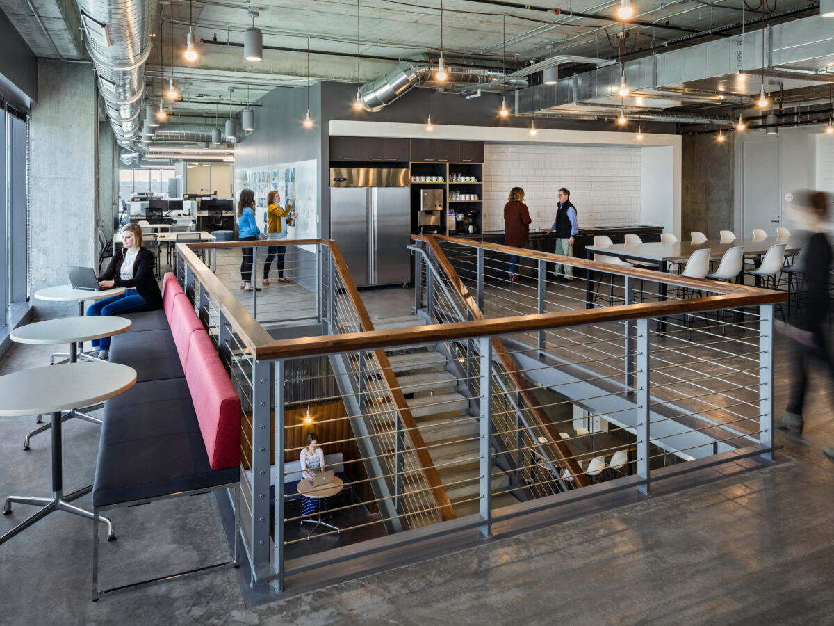 employees working and talking throughout upstairs hub space