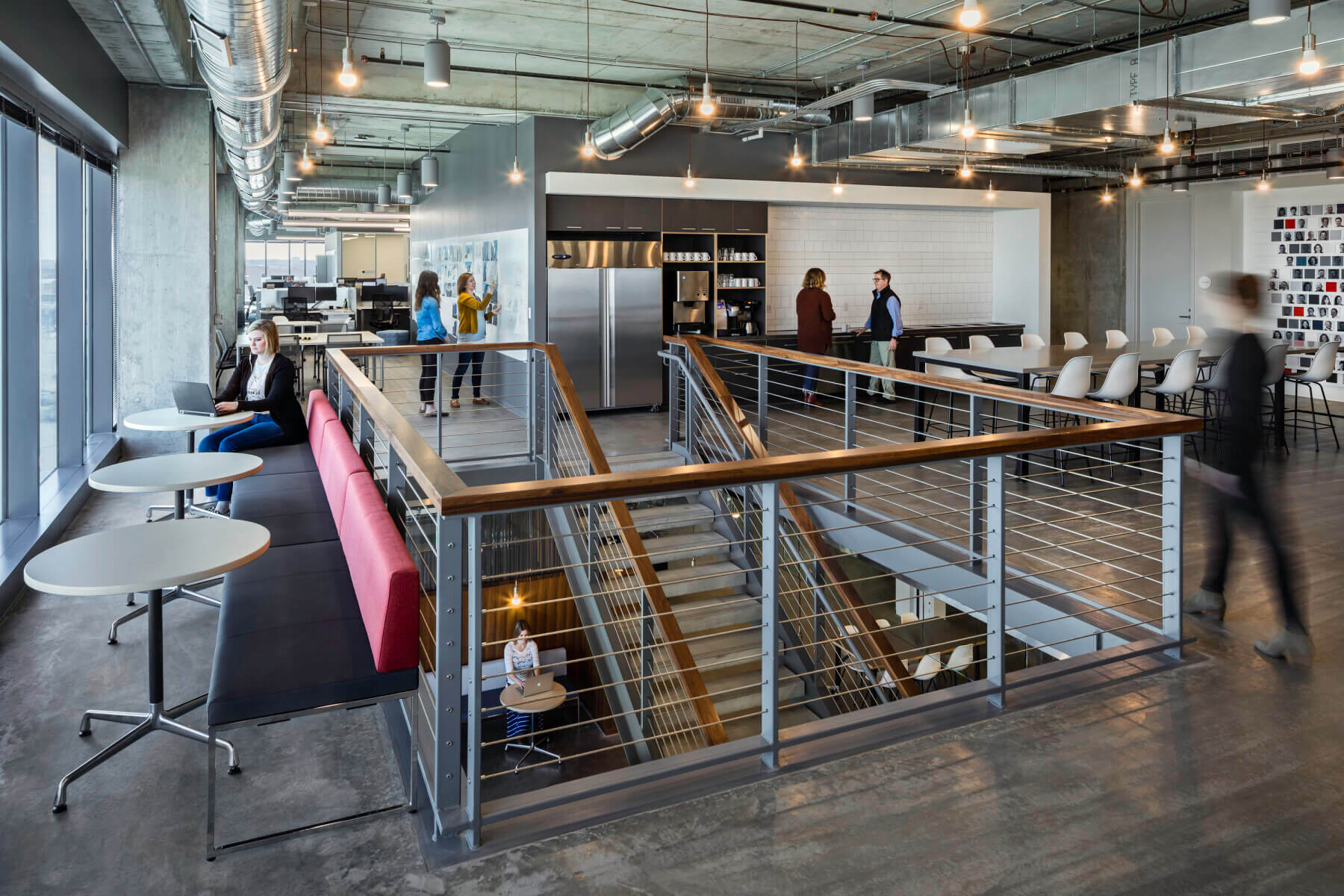 employees working and talking throughout upstairs hub space