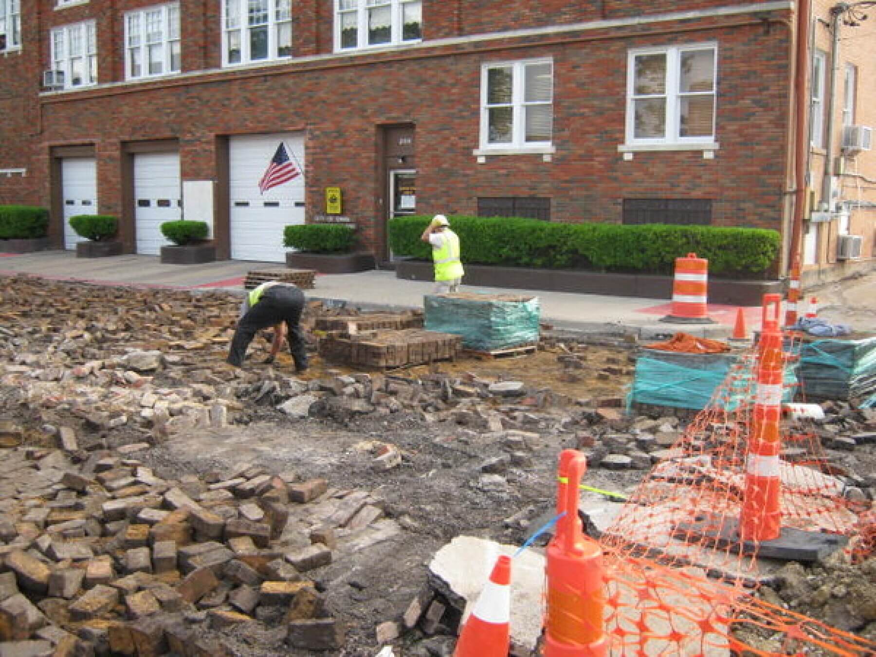 A construction site with cones and workers in downtown Ennis