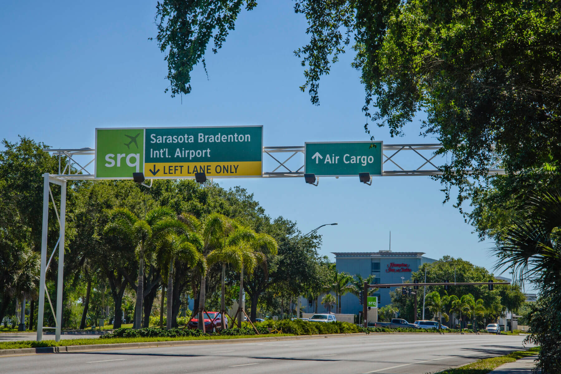 overhead roadway sign directing drivers to the air cargo entrance to Sarasota Bradenton International Airport