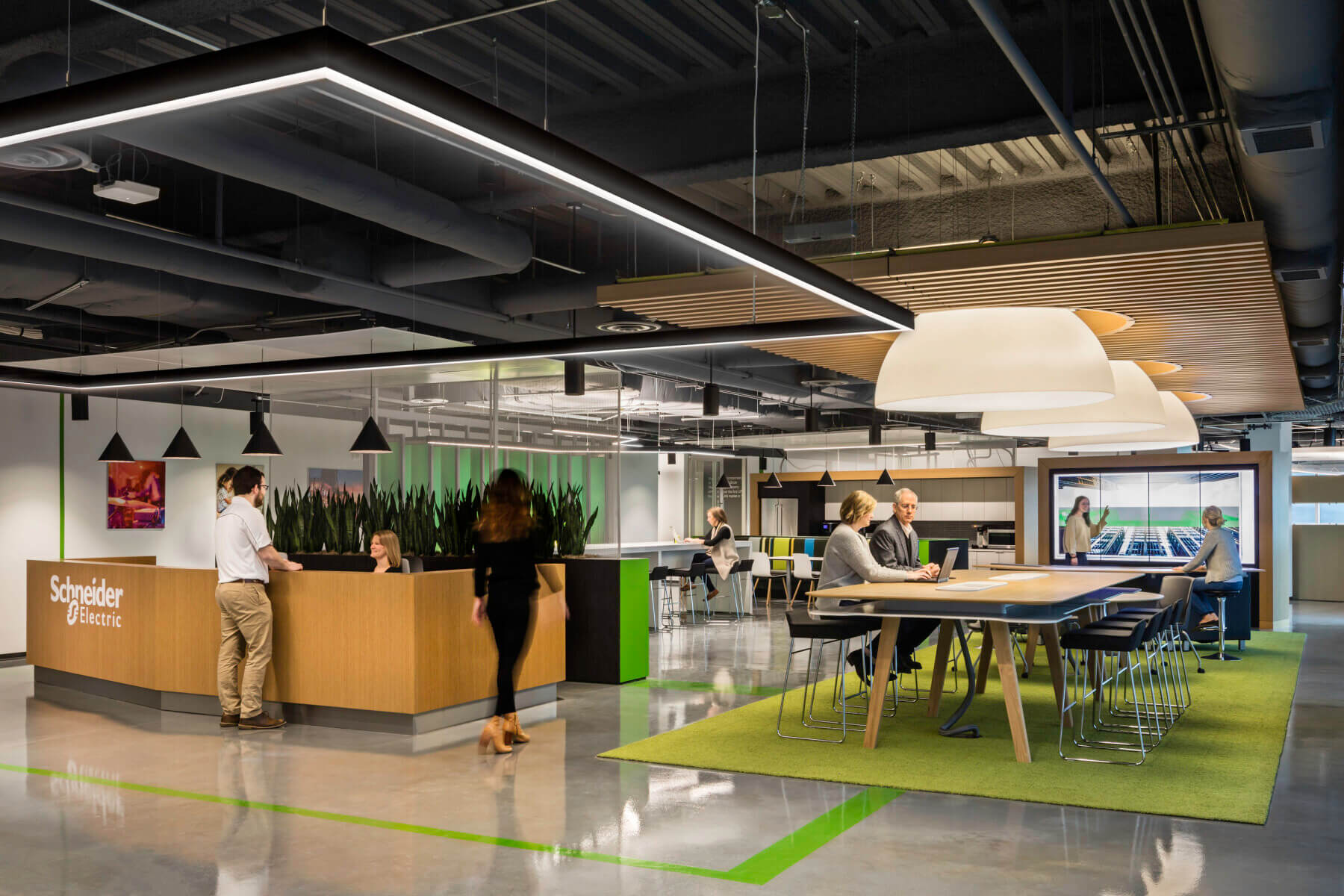 a common area with a reception and lobby Schneider Electric Offices