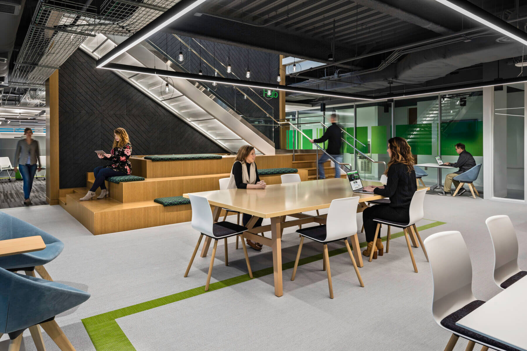 a connecting stair with a big table in the Schneider Electric Offices