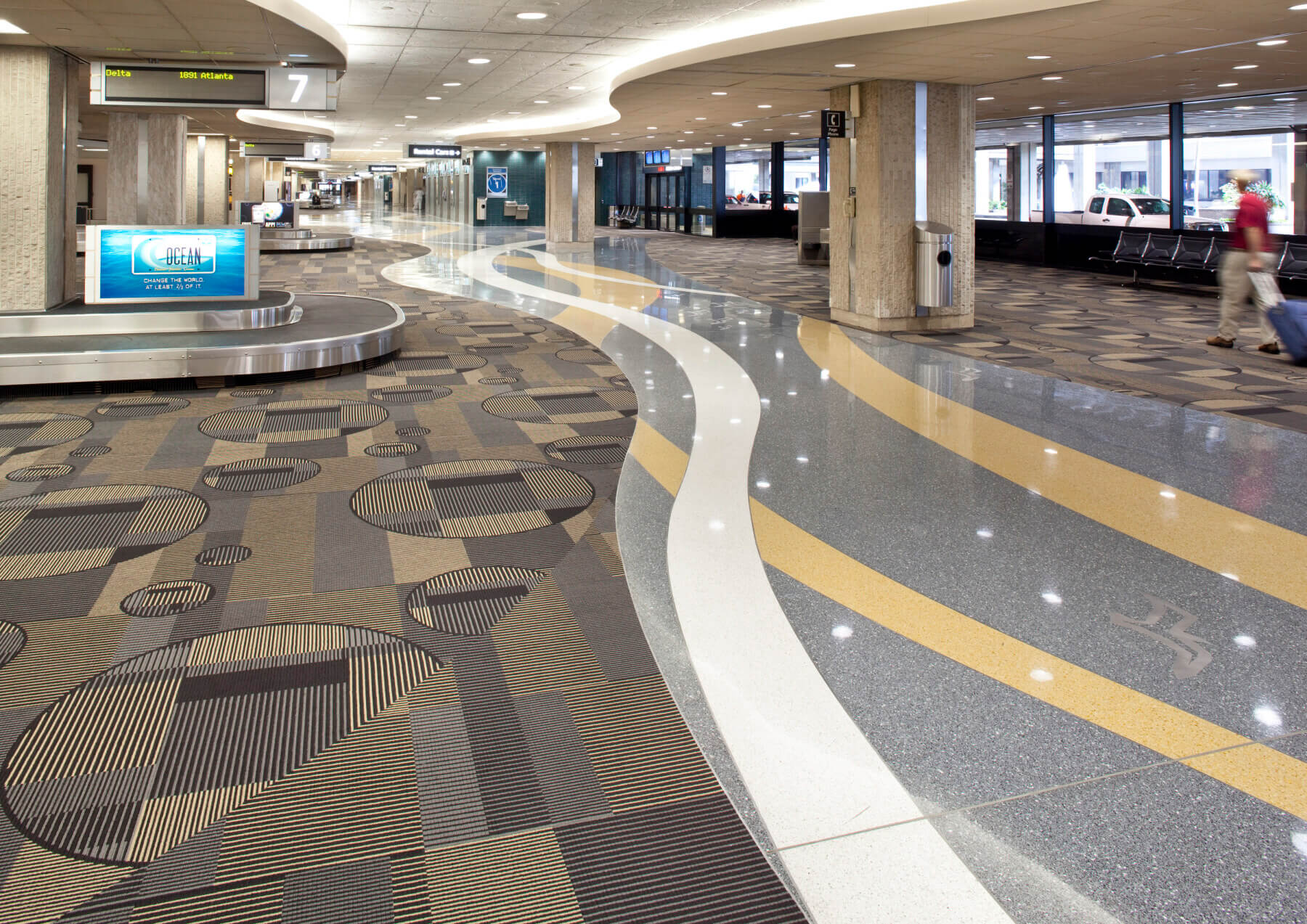 the tile and carpet pattern in the baggage claim area at Tampa International Airport