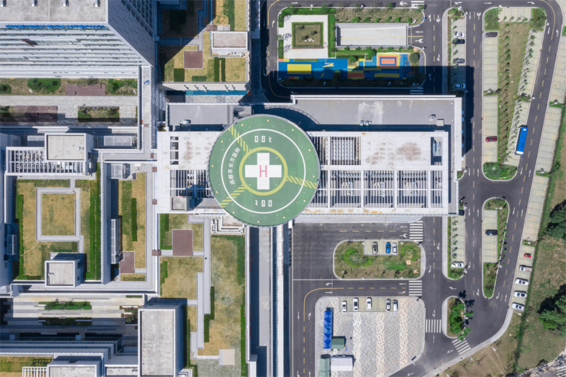 aerial view of hospital rooftops and helipad
