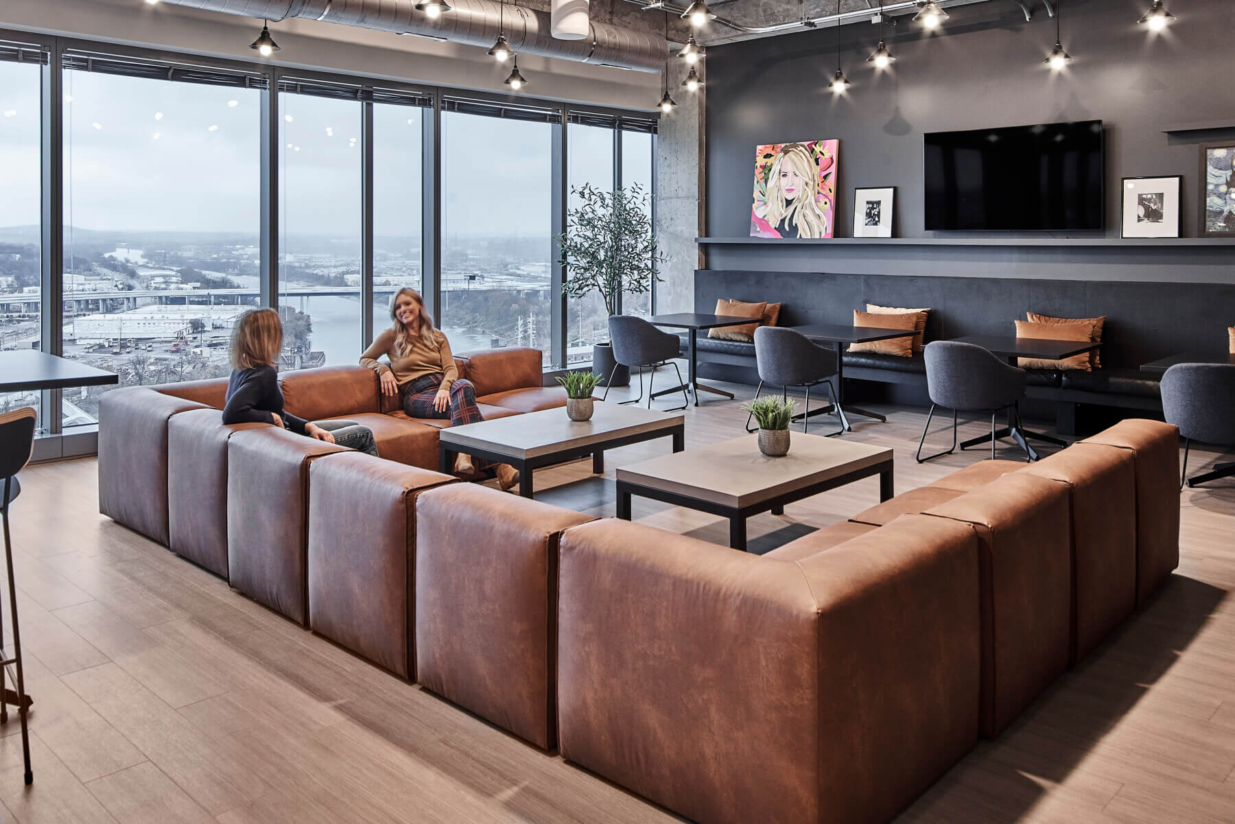 A lounge area with a large couch in the Universal Music Group Nashville offices