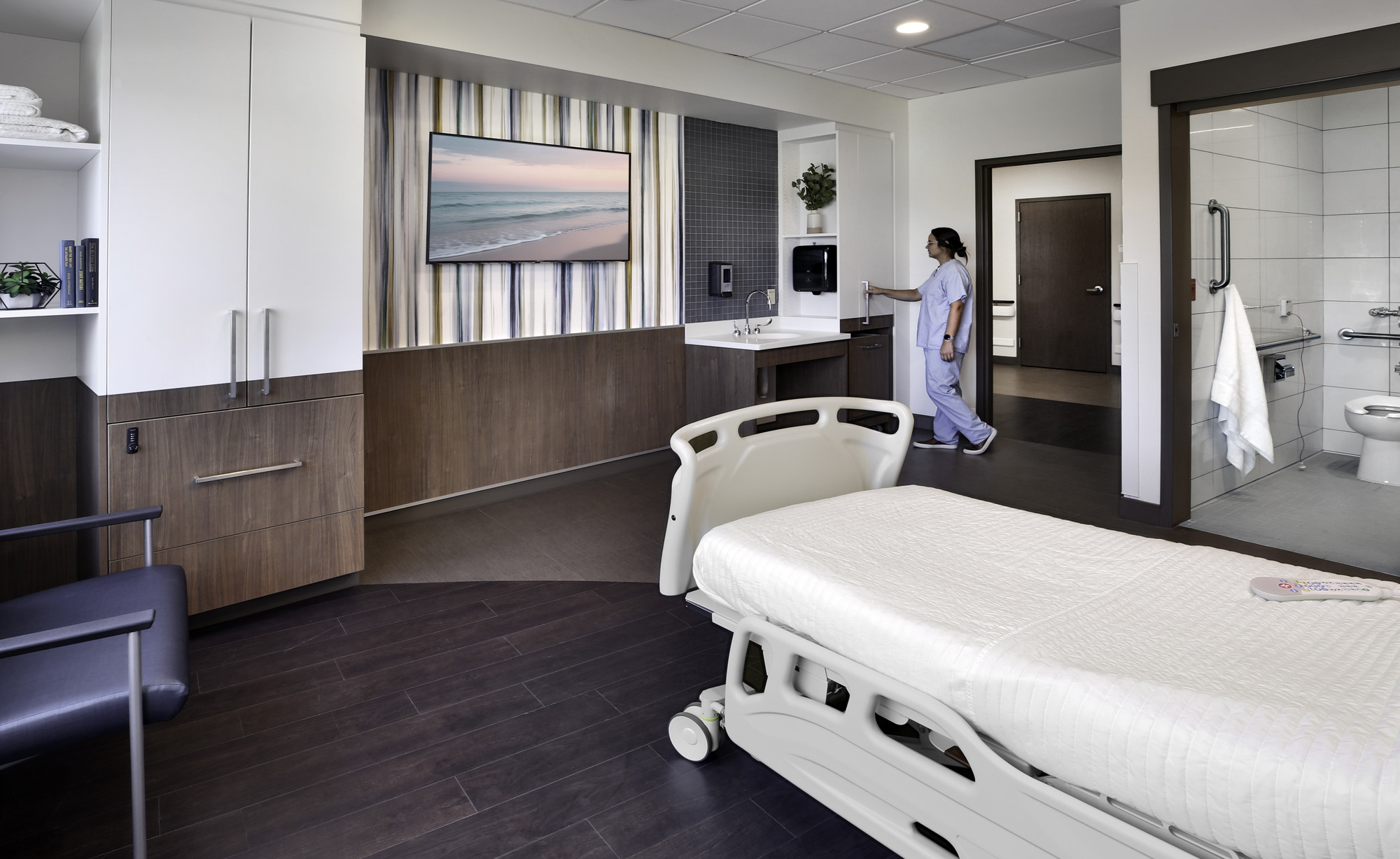 A nurse in a hospital patient room