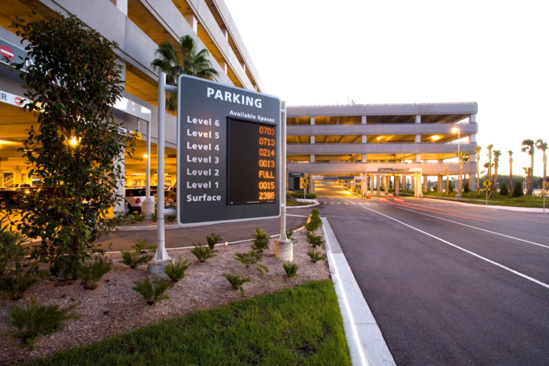 signage with available parking spaces outside the economy parking garage at Tampa International Airport at night