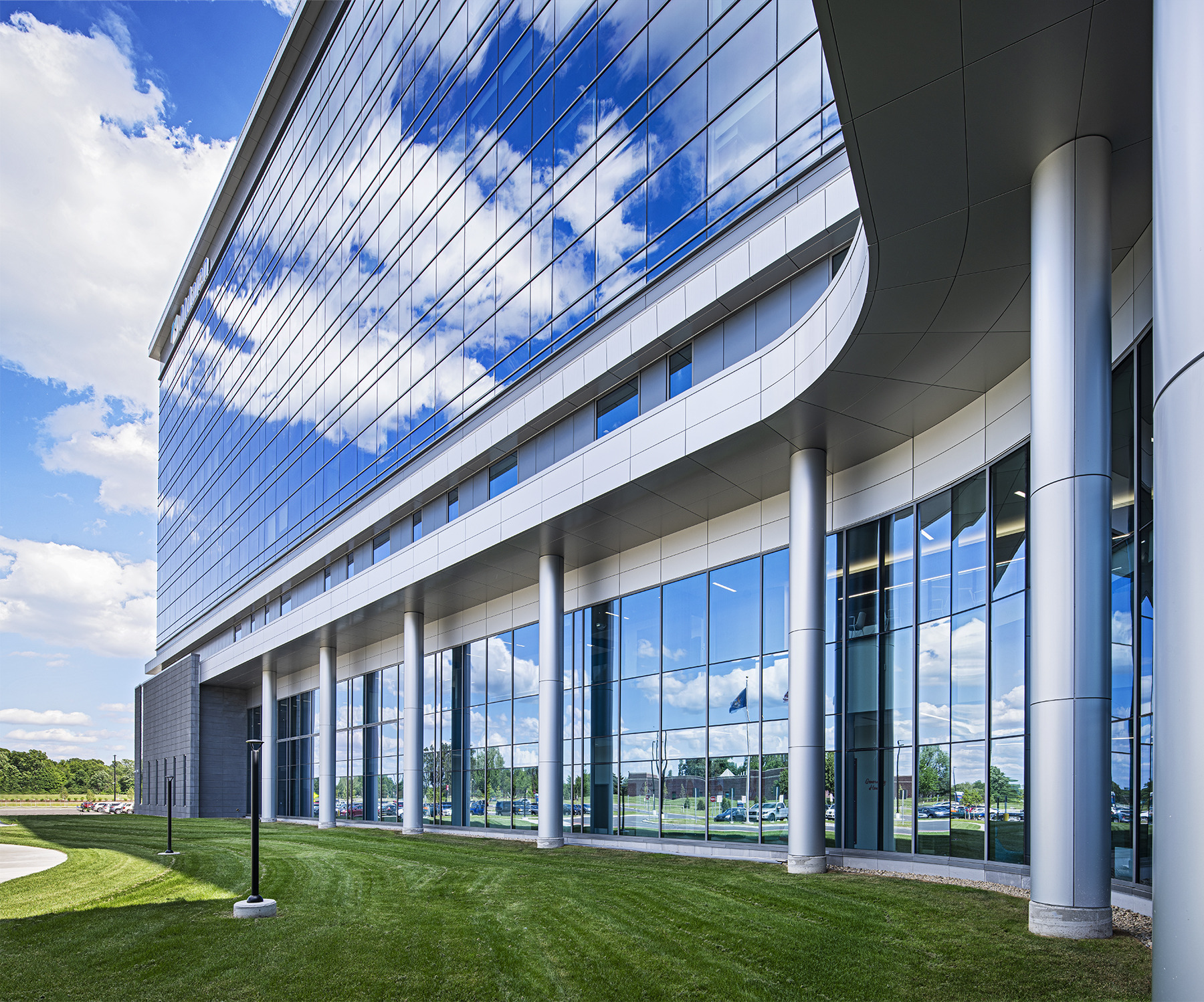 close up of the curved glad and metal façade of a hospital