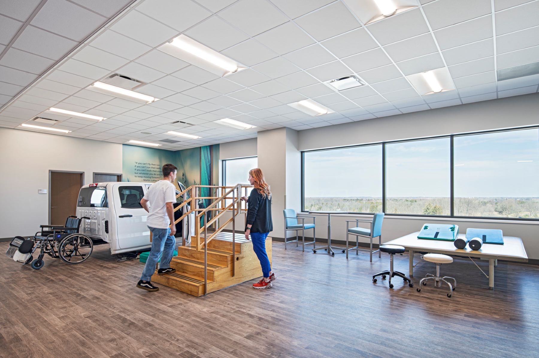 Two people in a physical rehabilitation gym