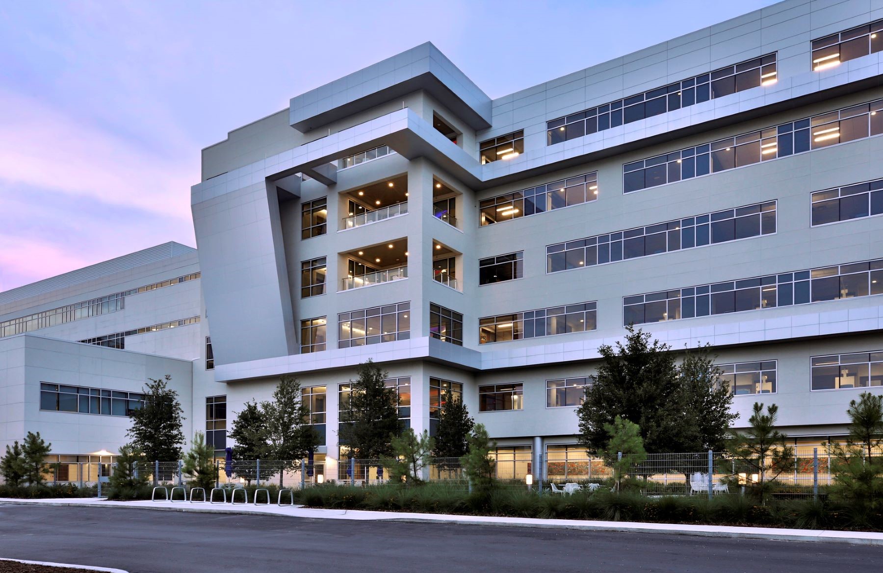 Exterior of a six story hospital at dusk