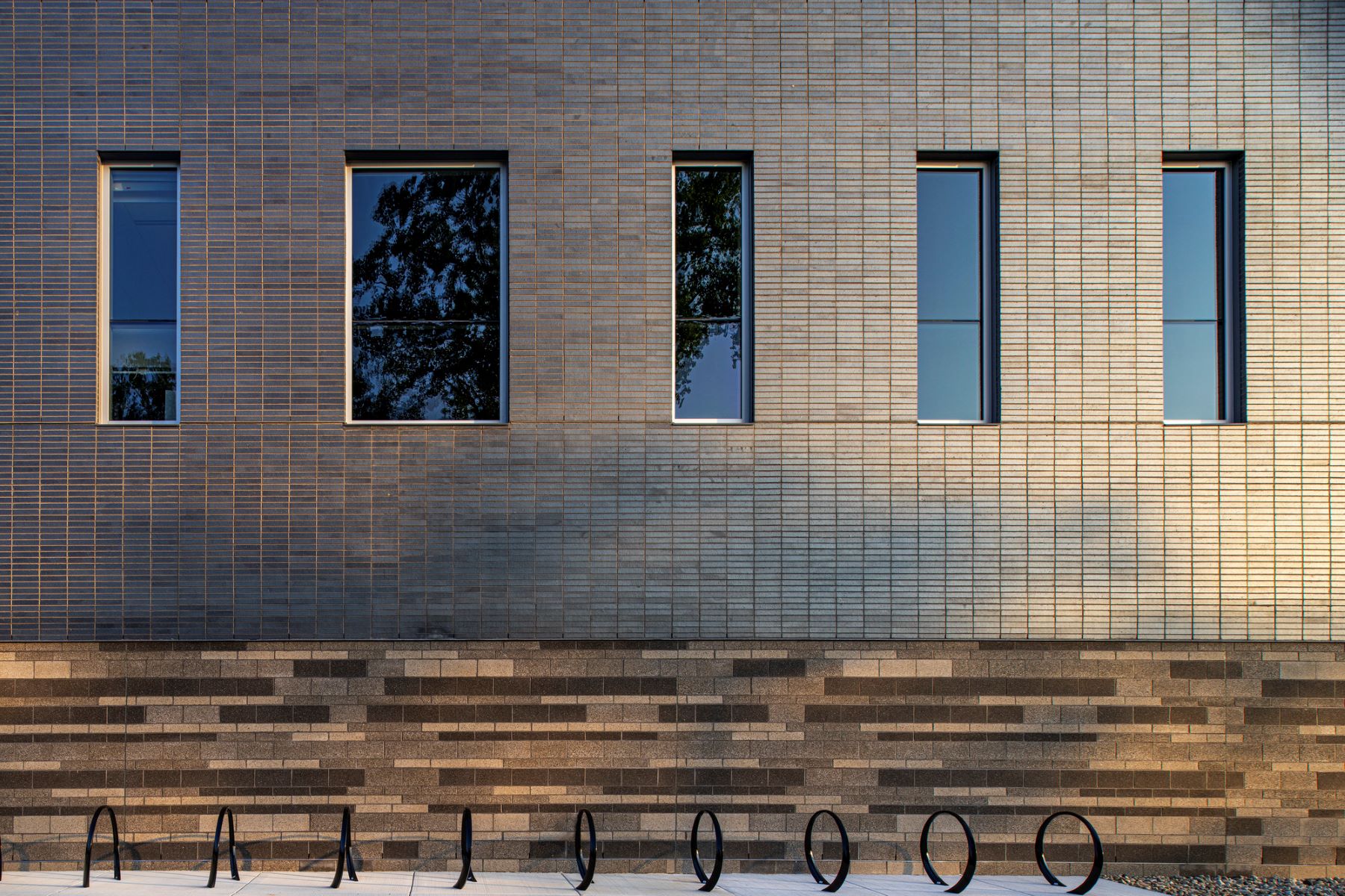 bike racks next to a brick and stone building