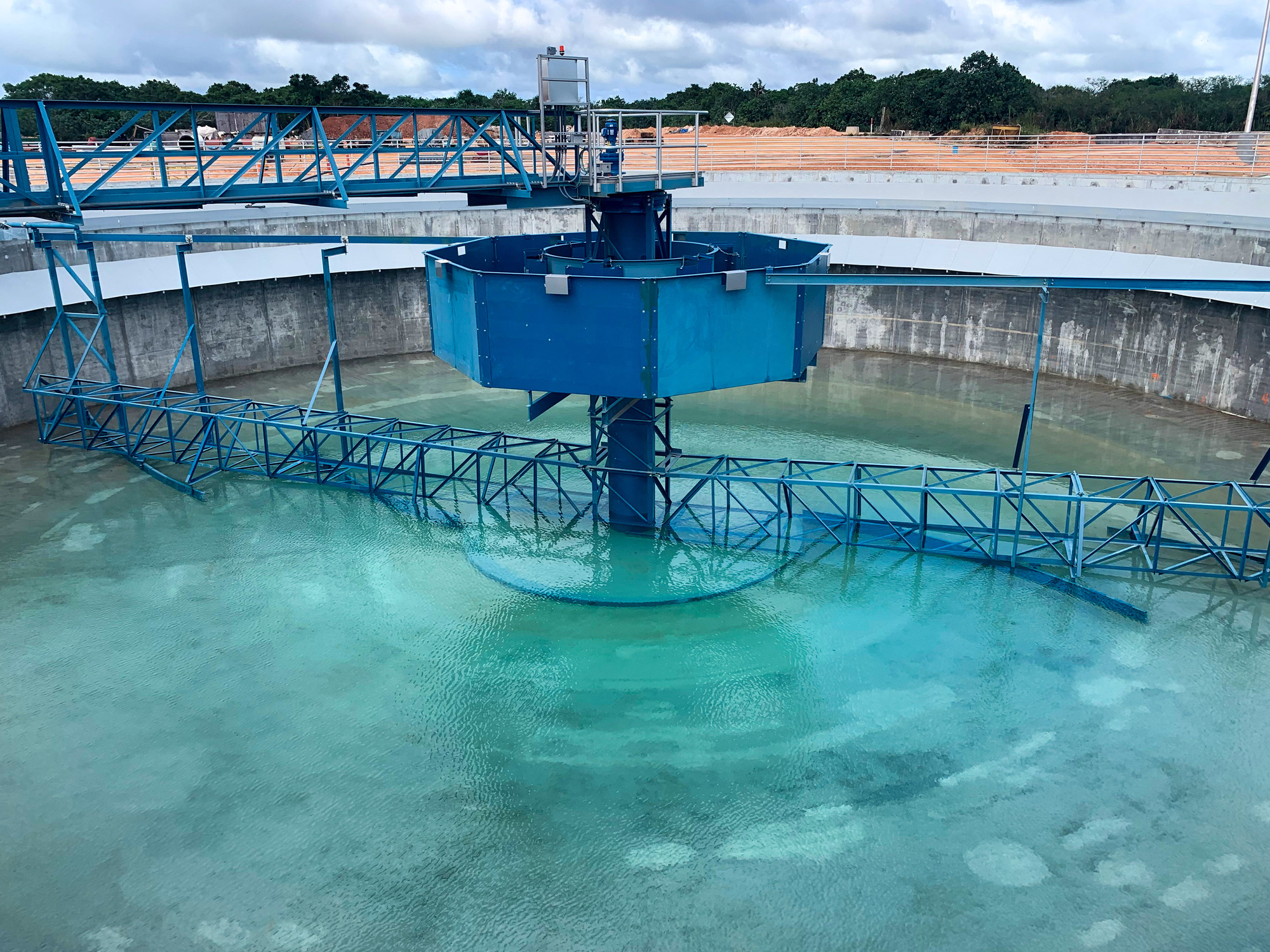 a clarifier at a wastewater treatment plant that's partially filled with water